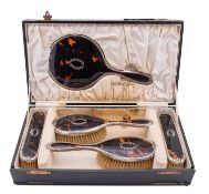 A George V silver and tortoiseshell dressing table set by William Comyns & Sons Ltd (Charles &
