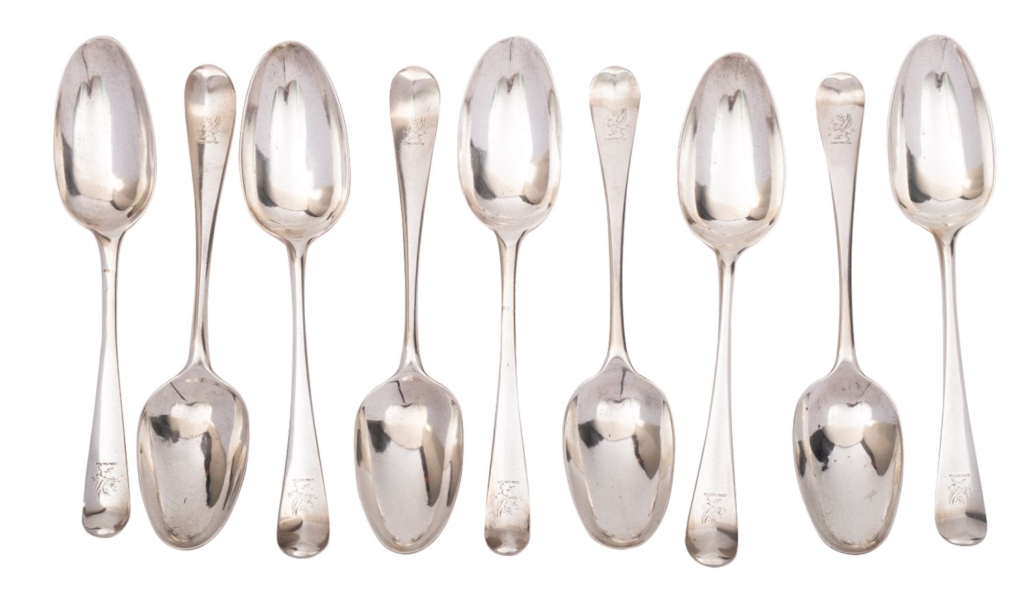 Nine Georgian silver Hanoverian pattern table spoons, various makers and dates,