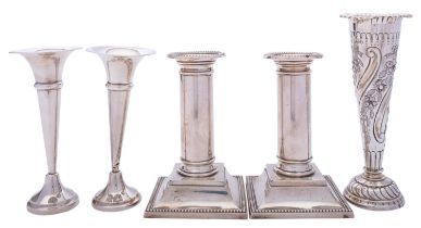 A pair of short Edward VII silver candlesticks by William Neale & Son, Birmingham 1908,