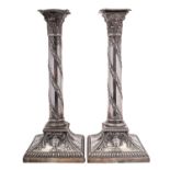 A pair of silver columnar candlesticks by West & Son, Sheffield 1911,