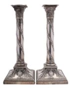 A pair of silver columnar candlesticks by West & Son, Sheffield 1911,