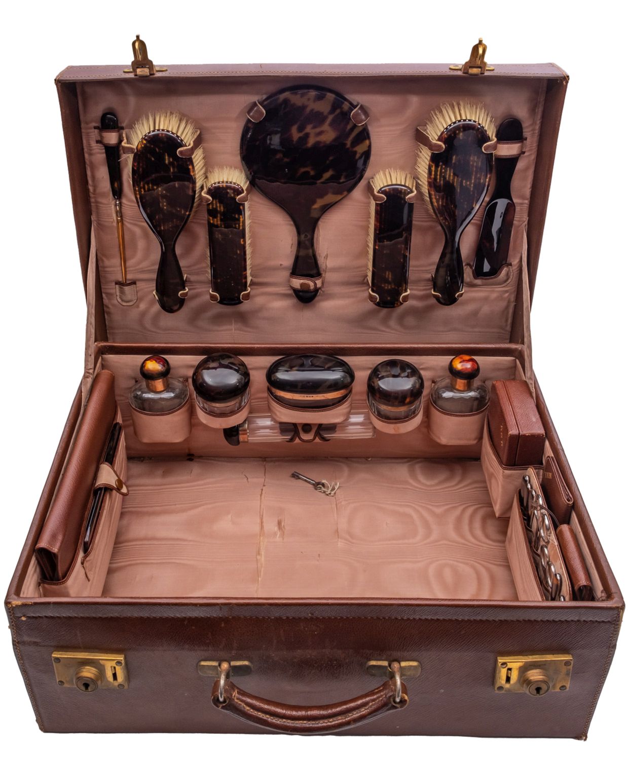 A George V leather, faux tortoiseshell and silver lady's vanity case by D C Bs, London 1929,