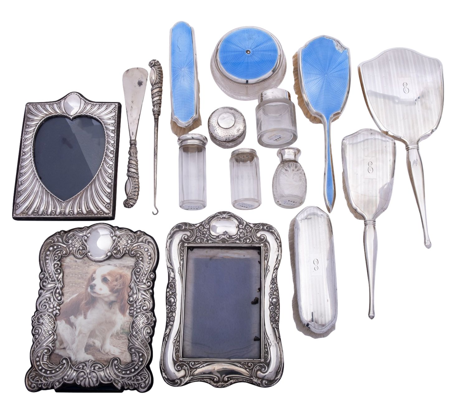 A group of silver items comprising: a cased pair of silver handled shoehorn and button hook,