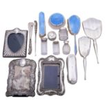 A group of silver items comprising: a cased pair of silver handled shoehorn and button hook,