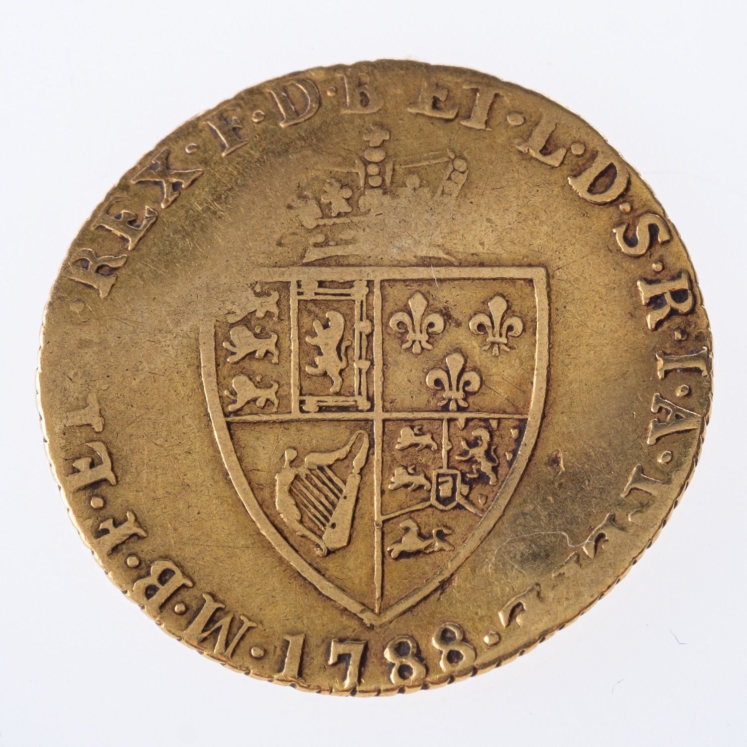 A George III gold coin, unmounted, worn, dated 1788, 4.0grams.