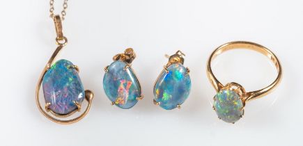 A group of opal jewellery, including a ring set with an oval opal cabochon, Foreign marks, size L,