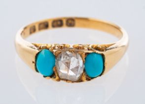 An antique 18ct yellow gold three stone ring, set centrally with a rose-cut diamond,