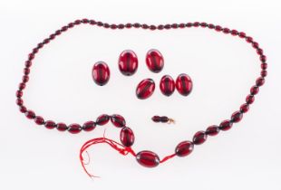 WITHDRAWN LOT A 1920's red bead necklace, a string of graduated red beads, string broken,