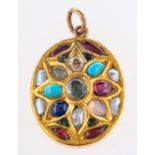 An ornate oval designed pendant,