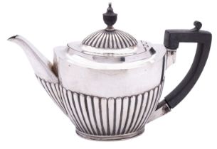 A Victorian silver tea pot by Mappin Brothers, Sheffield 1893, of oval part reeded form, 470g (15.