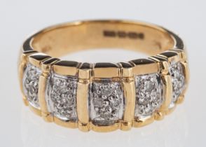A 9ct yellow & white gold diamond set dress ring, with five pave set panels, total diamond weight 0.