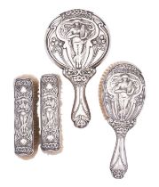 An Edward VII Art Nouveau long handled hair brush and mirror by Walker and Hall, Sheffield 1904,