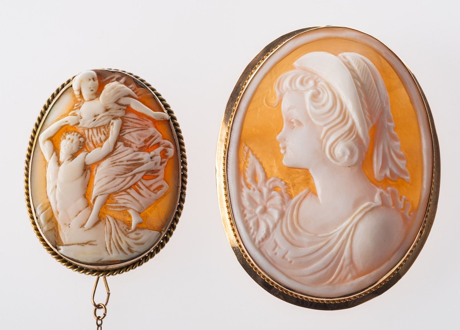 Two cameo brooches, an oval cameo with brooch and pendant fittings, marked 375, measuring approx. 5.