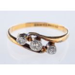 A three stone ring, collet set with old European cut diamonds, diamonds approx. 0.