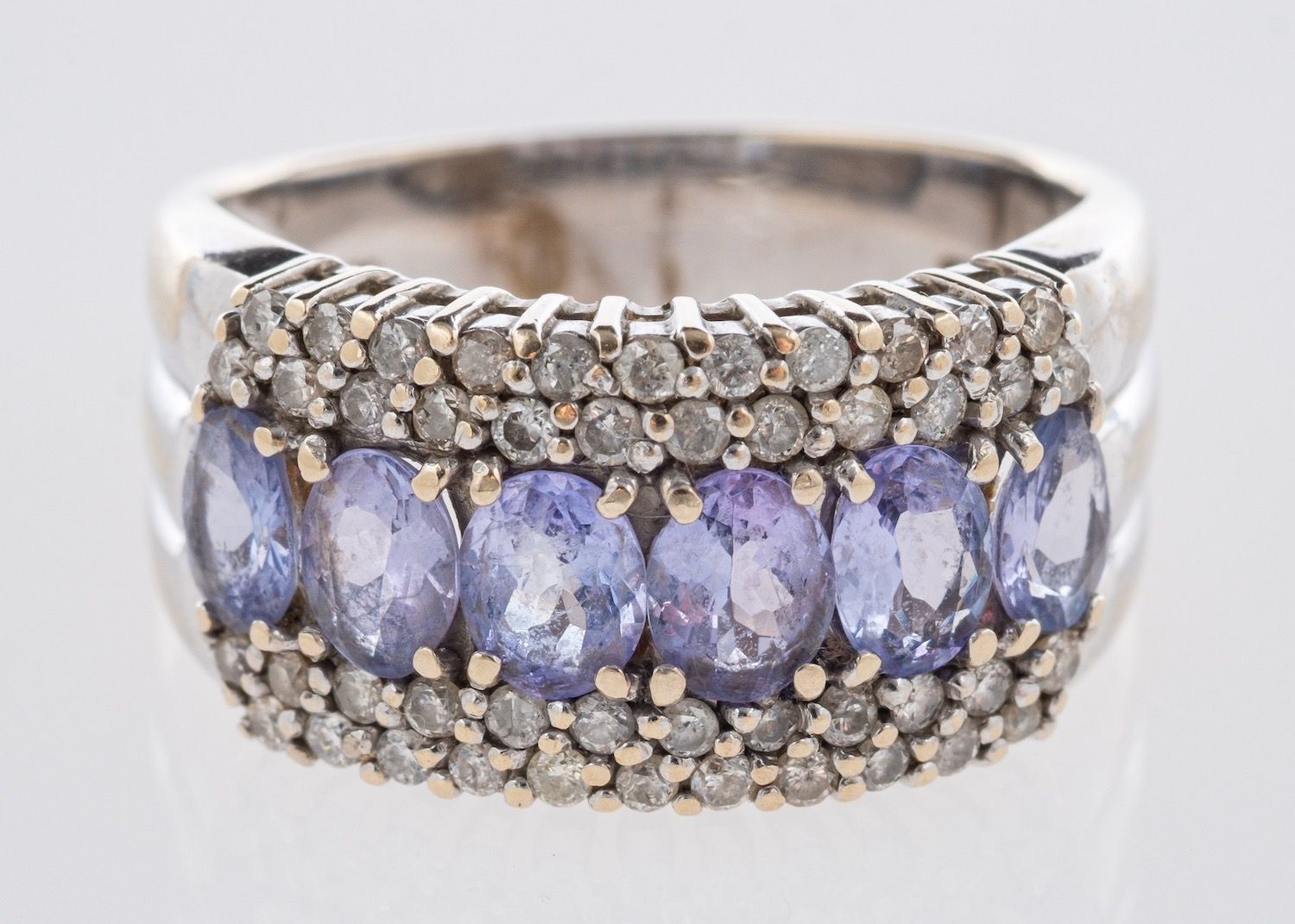 A tanzanite and diamond ring, a five row ring,