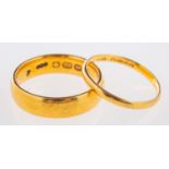 Two 22ct yellow gold wedding bands, both UK hallmarked, sizes M and K1/2, total gross weight 7.
