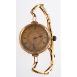 A ladies foliate engraved open faced pocket watch, gilt flower dial and Roman numeral markers,