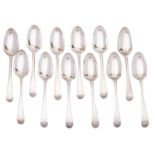 A set of twelve Georgian silver Old English pattern table spoons, maker W T, London 1768/69,