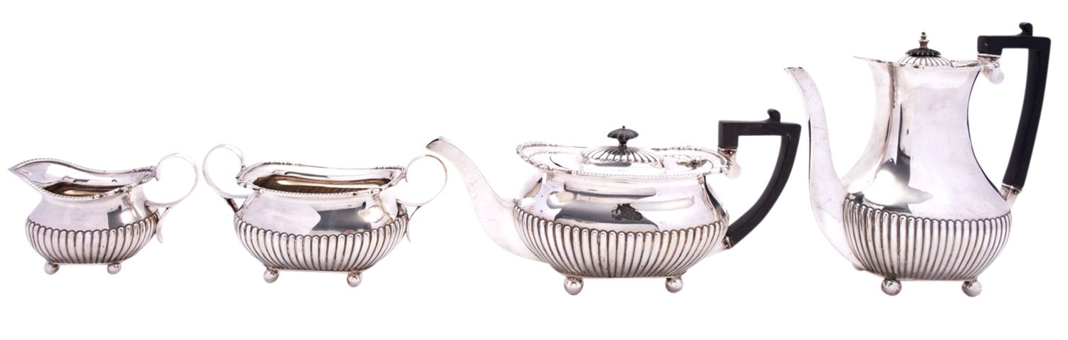 A George V silver four piece silver tea and coffee service by William Hutton & Sons Ltd,