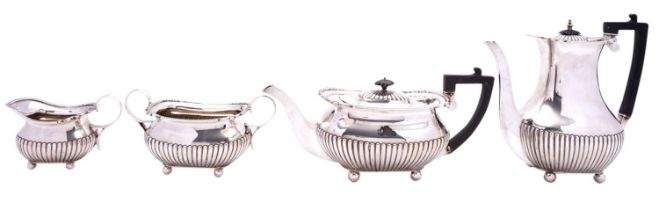 A George V silver four piece silver tea and coffee service by William Hutton & Sons Ltd,