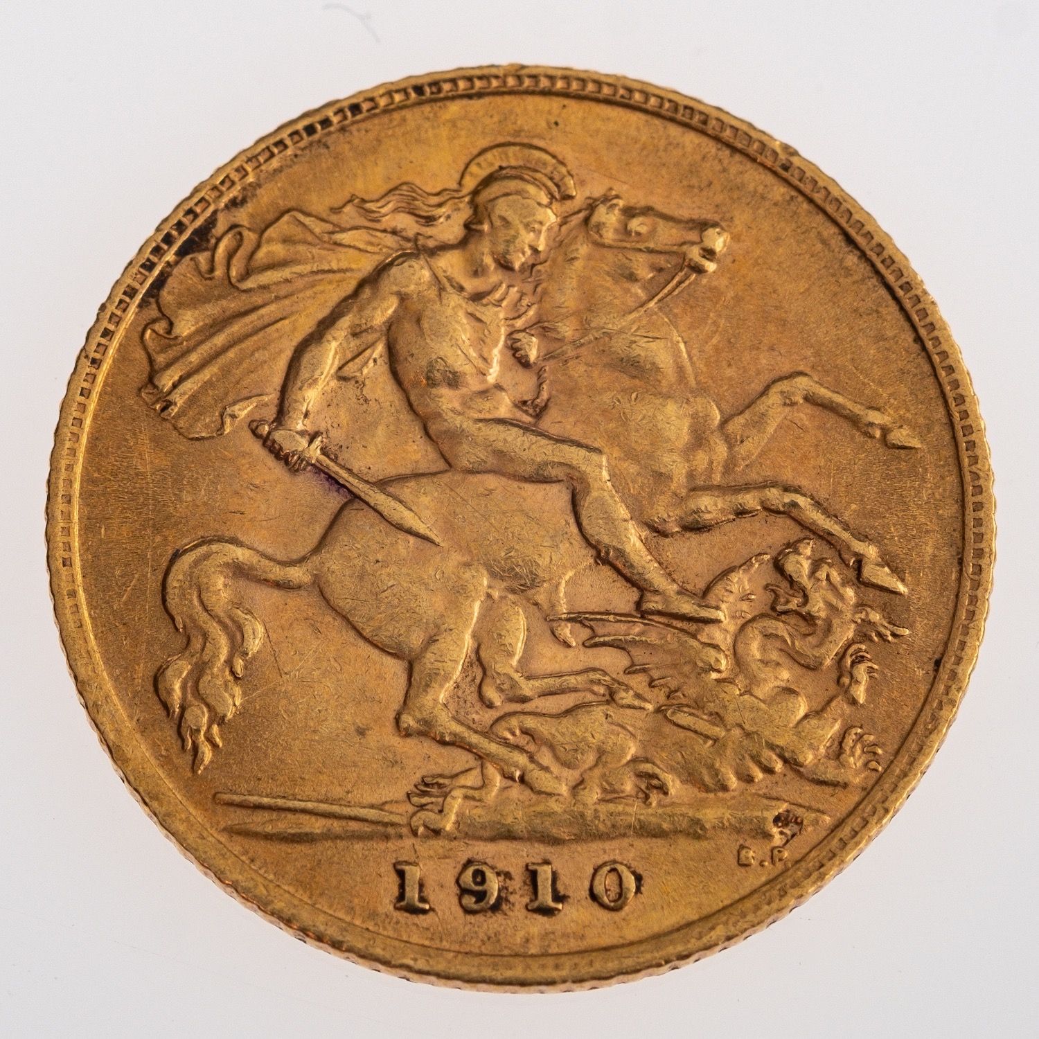 A gold sovereign, an Edward VII half sovereign, 1910, 4.0grams.