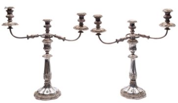 A pair of Sheffield plated silver candelabra, un-marked, each with three detachable scones,