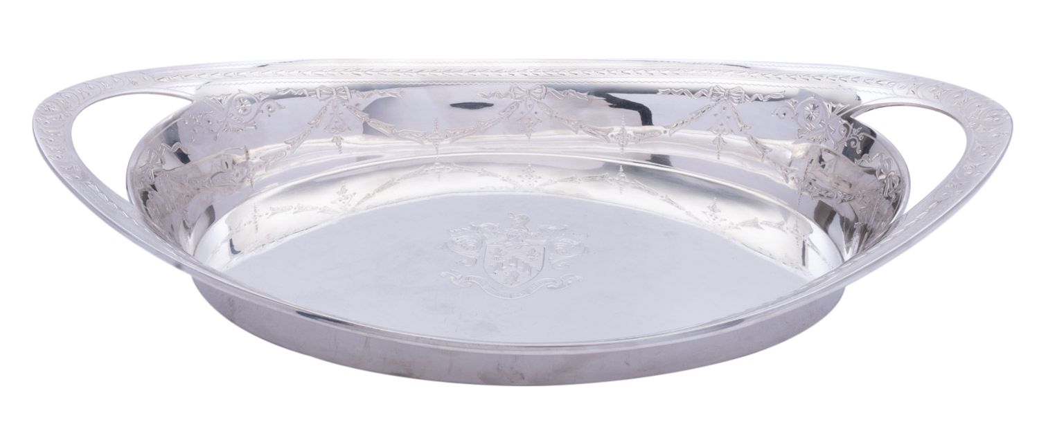 A Victorian silver oval bread tray by Walter & John Barnard, London 1883, of oval form,