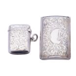 A Victorian silver vesta case by E T, Birmingham 1900, of concave rectangular form,