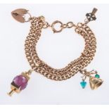 A charm bracelet with three charms, a double-row curb bracelet with heart padlock,