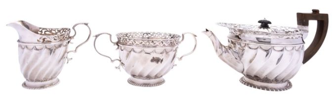 A Victorian three piece silver tea service by Goldsmiths and Silversmiths Co.
