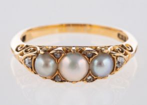 A Victorian carved half hoop ring, set with split pearls,