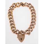 A heart padlock bracelet, with textured and polished curb links, safety chain, marked 9ct,