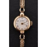 Vertex a 9ct gold ladies watch, the round silvered dial with black Arabic numerals,