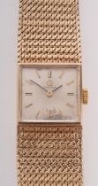Omega a lady's 9ct gold wristwatch the square dial with baton numerals and hands,