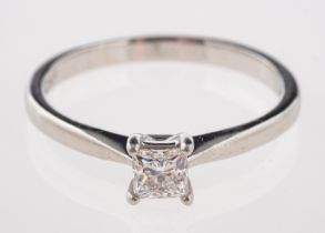 A platinum and diamond ring, set with a single princess-cut diamond, diamond approx. 0.