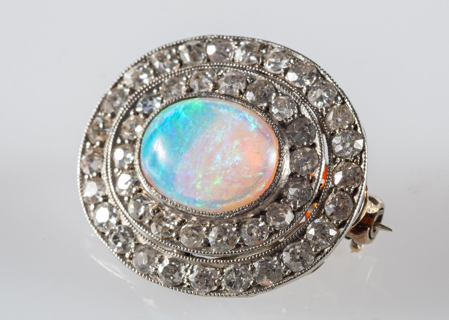An opal and diamond brooch, set with an oval opal cabochon, - Image 2 of 2