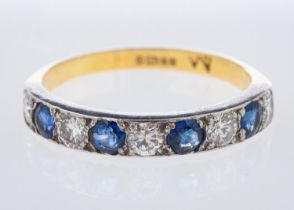 An 18ct gold half eternity ring, with alternating brilliant-cut diamonds and circular-cut sapphires,