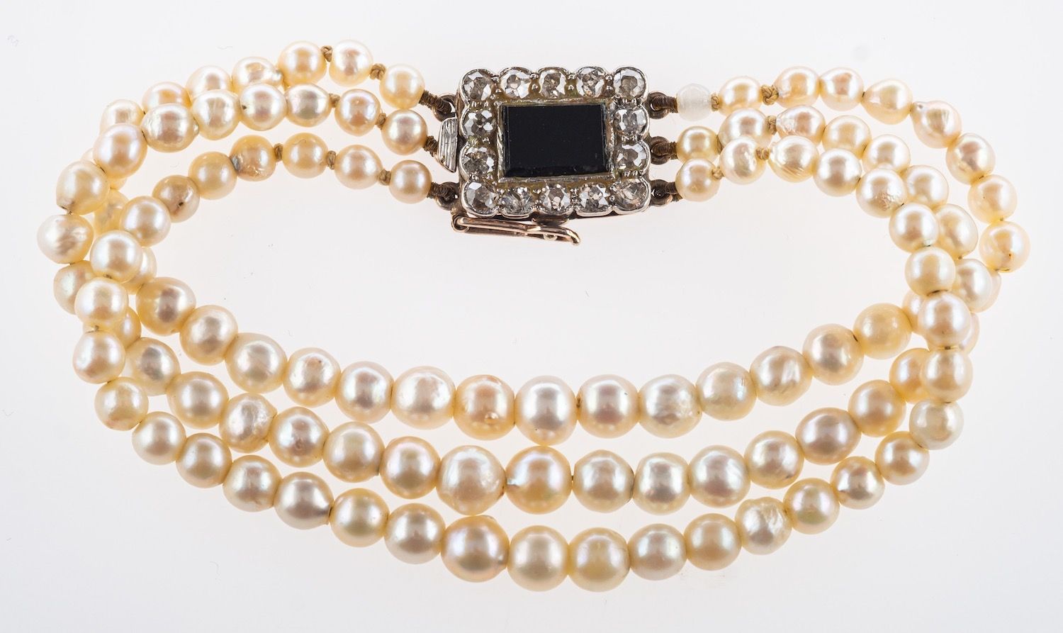 A three row pearl bracelet, three rows of small graduated cultured pearls, sizes range approx.