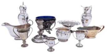 A mixed group of silver and silver plated items comprising: a sugar shifter, a sauce boat,
