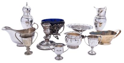 A mixed group of silver and silver plated items comprising: a sugar shifter, a sauce boat,
