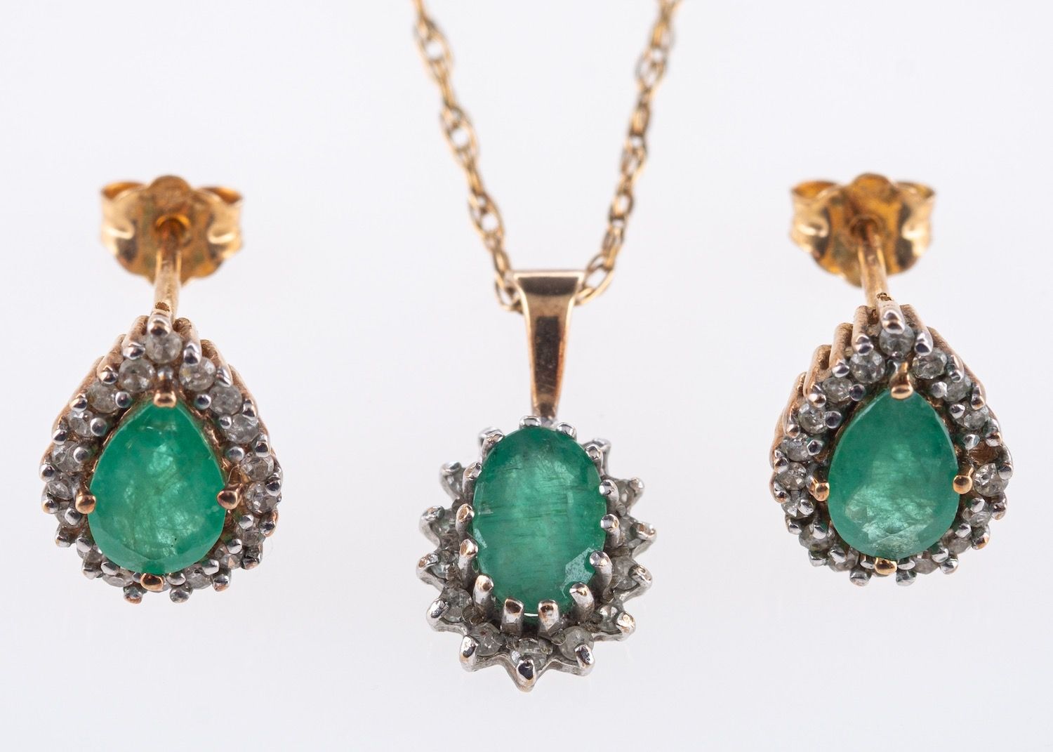 An emerald and diamond necklace and earrings,
