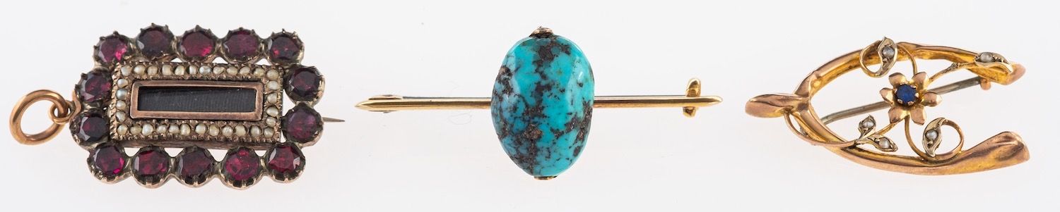 A group of three brooches, including a bar brooch set with turquoise, marked 15ct, 4.