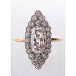 A marquise shaped cluster ring set centrally with an elongated oval-cut diamond, diamond approx. 1.