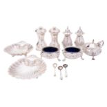 A group of silver items comprising: a matched five-piece cruet set,