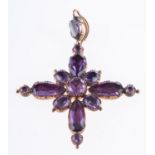 An early 19th century pendant in the shape of a cross,