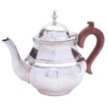 A George V silver tea pot, marks rubbed, Birmingham 1919, of octagonal form,