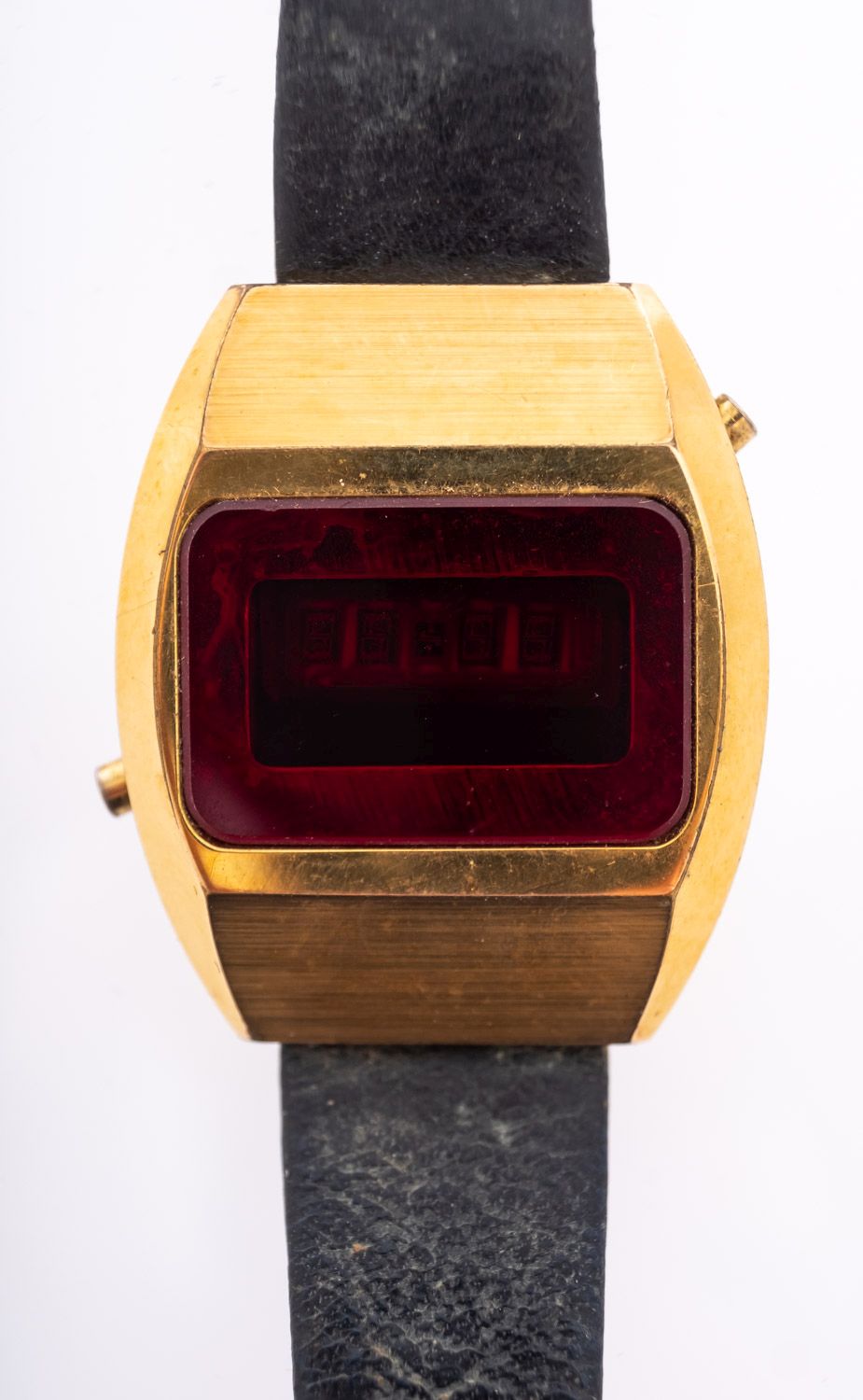 Accurist, a 1970s LED gold-plated wristwatch, the cushion-shaped case with leather strap,