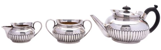 A matched three piece silver tea service, tea pot maker's mark over struck, London 1895,