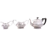 An Edward VII three piece silver tea service by William Adams Ltd, Birmingham 1903,