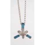 A contemporary diamond pendant and chain, the pendant is set with three baguette-cut blue diamonds,